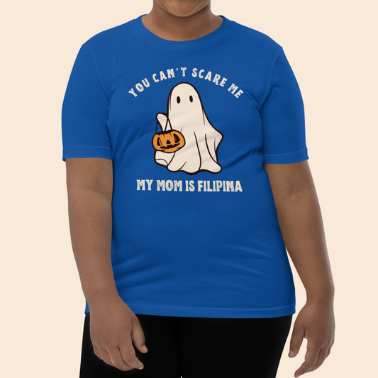 Girl wearing the Kids Shirt You Can't Scare Me My Mom Is Filipina Funny Kids/Youth Halloween Tee