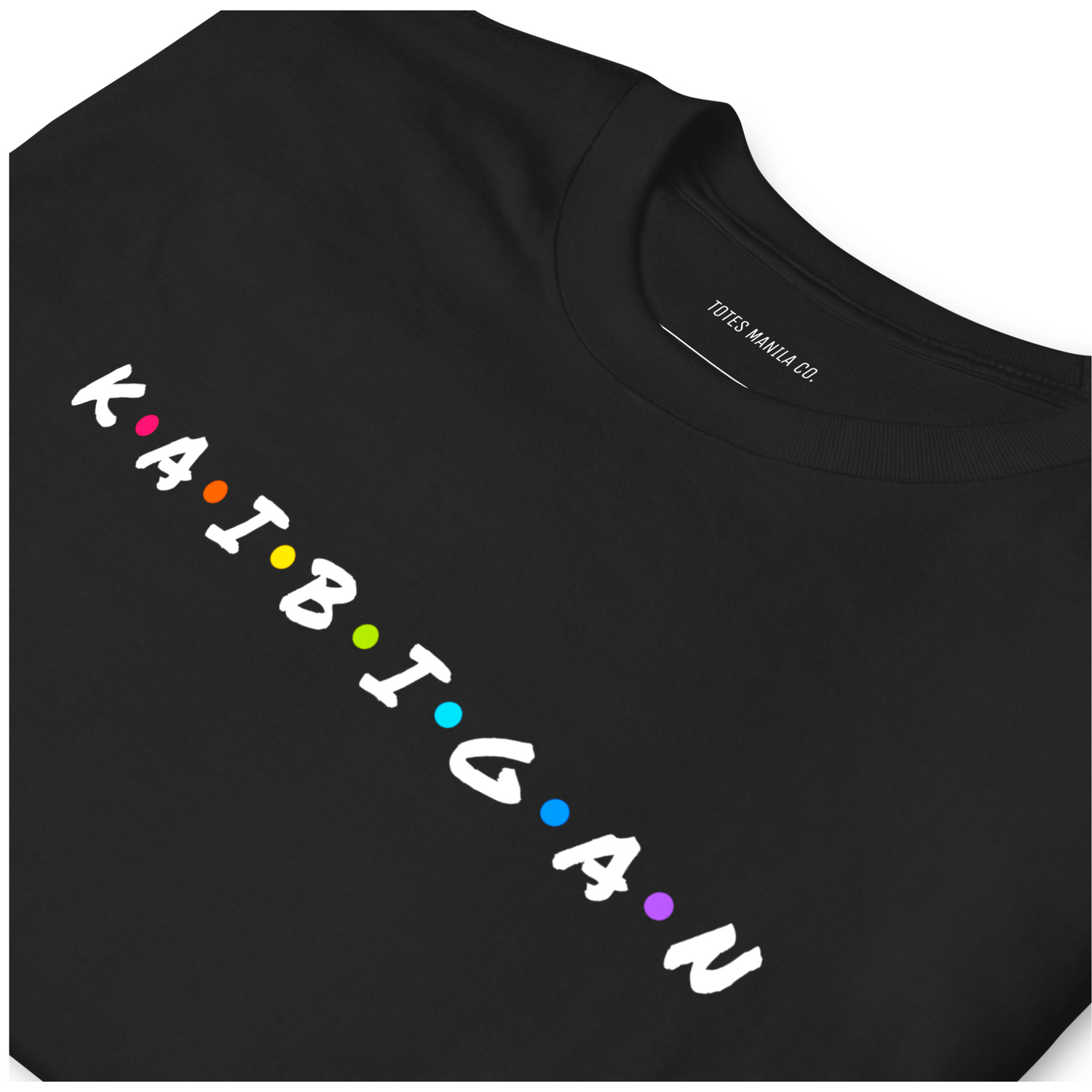 Close up of the Kaibigan design printed on a black unisex t-shirt.