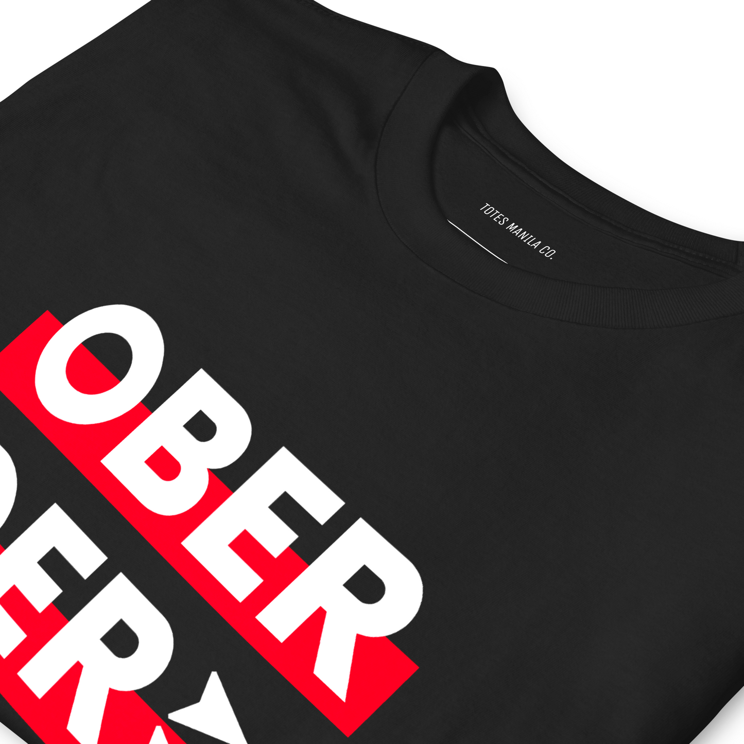 Close up of the Ober Der design in a unisex black t-shirt.