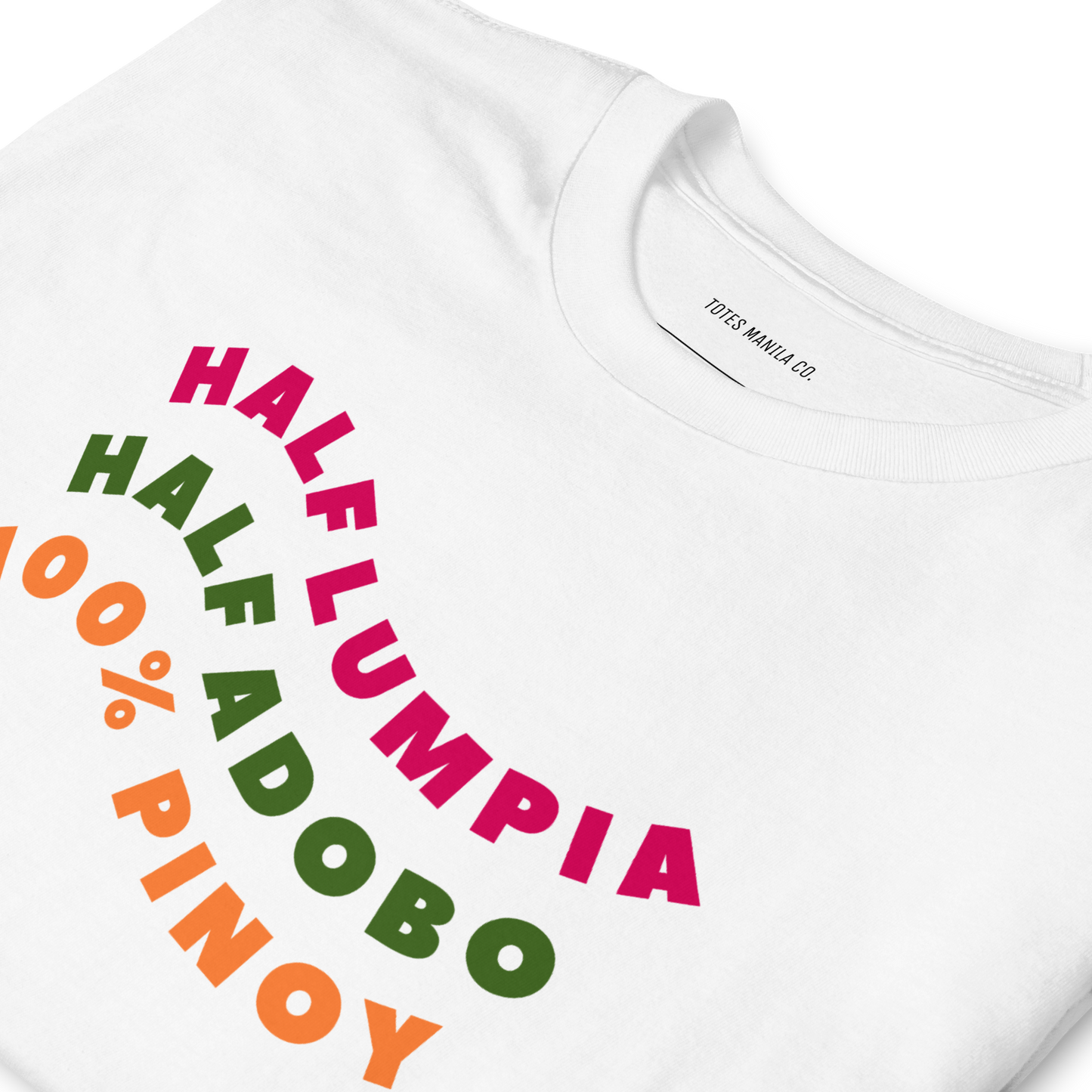 Close up of the Half Lumpia Half Adobo 100% Lumpia design printed on the center chest of a white unisex shirt.