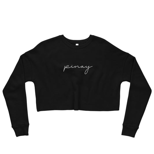 Flat lay view of a cropped sweatshirt embroidered with the 'Pinay' design.